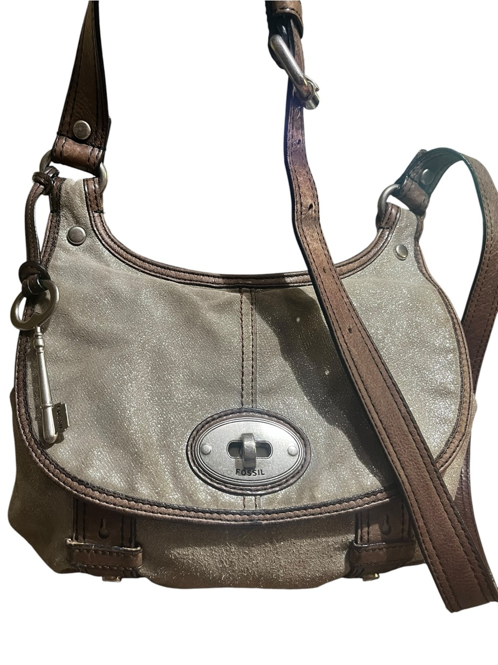 Fossil Glitter And Suede Saddle Bag With Turn lock.
